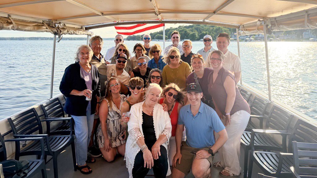 The Geneva Lakes Vacations team together on Geneva Lake